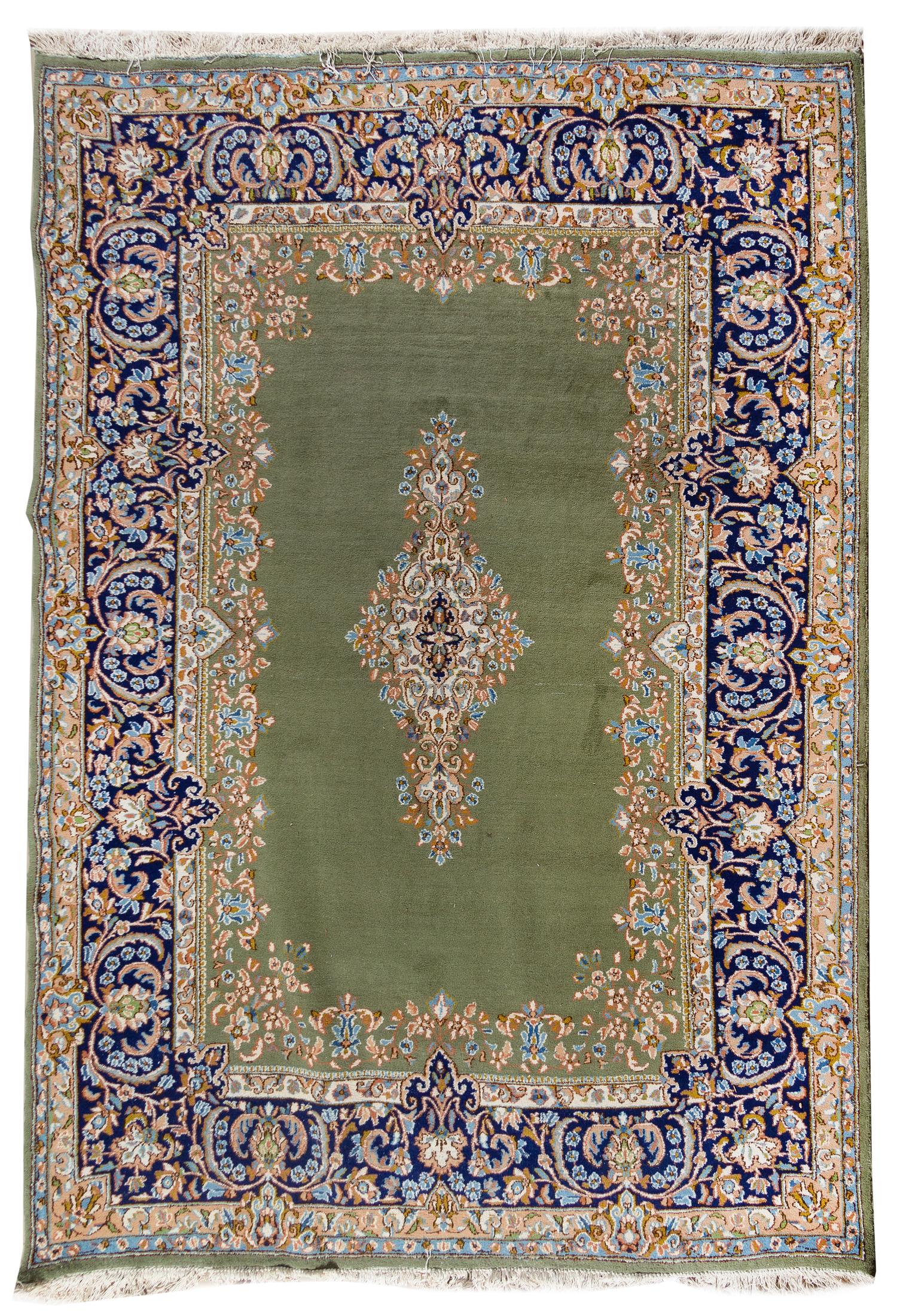 A Kirman Wool Rug 10 feet 2 1/2 inches x 7 feet 5 inches. — 20TH CENTURY