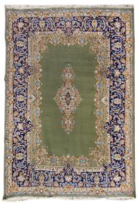 A Kirman Wool Rug 10 feet 2 1/2 inches x 7 feet 5 inches. — 20TH CENTURY