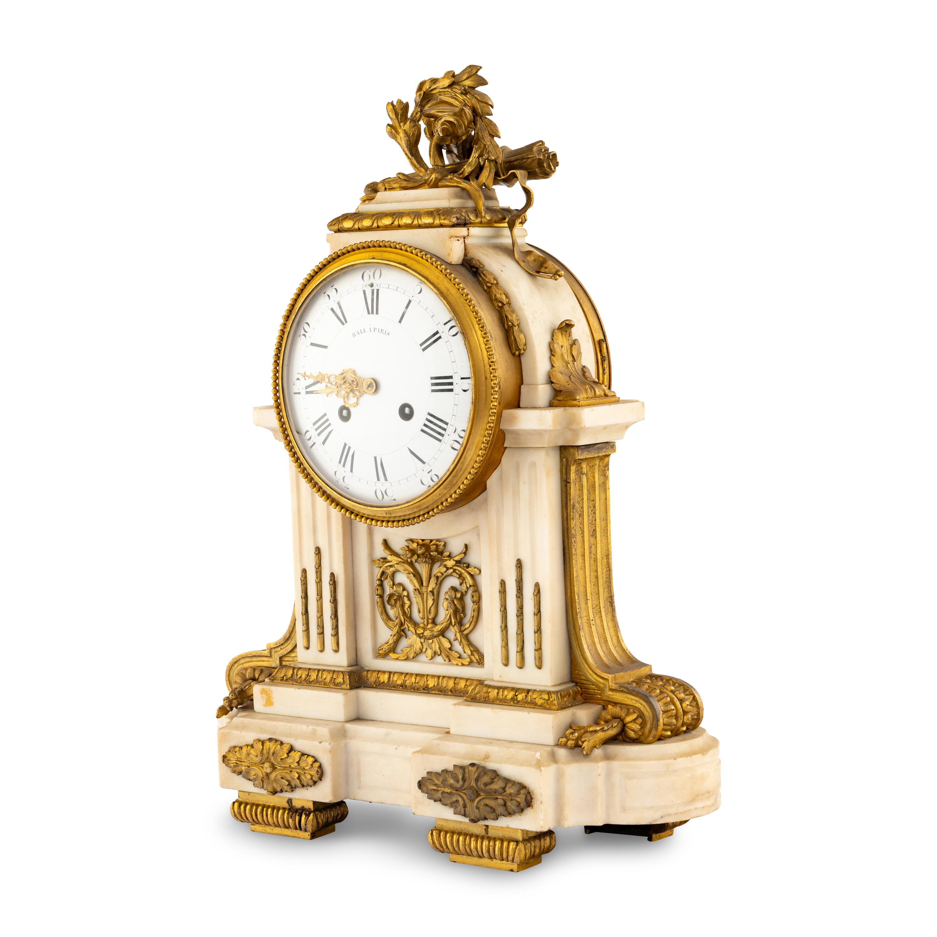 A Louis XVI Style Gilt Bronze Mounted Marble Mantel Clock