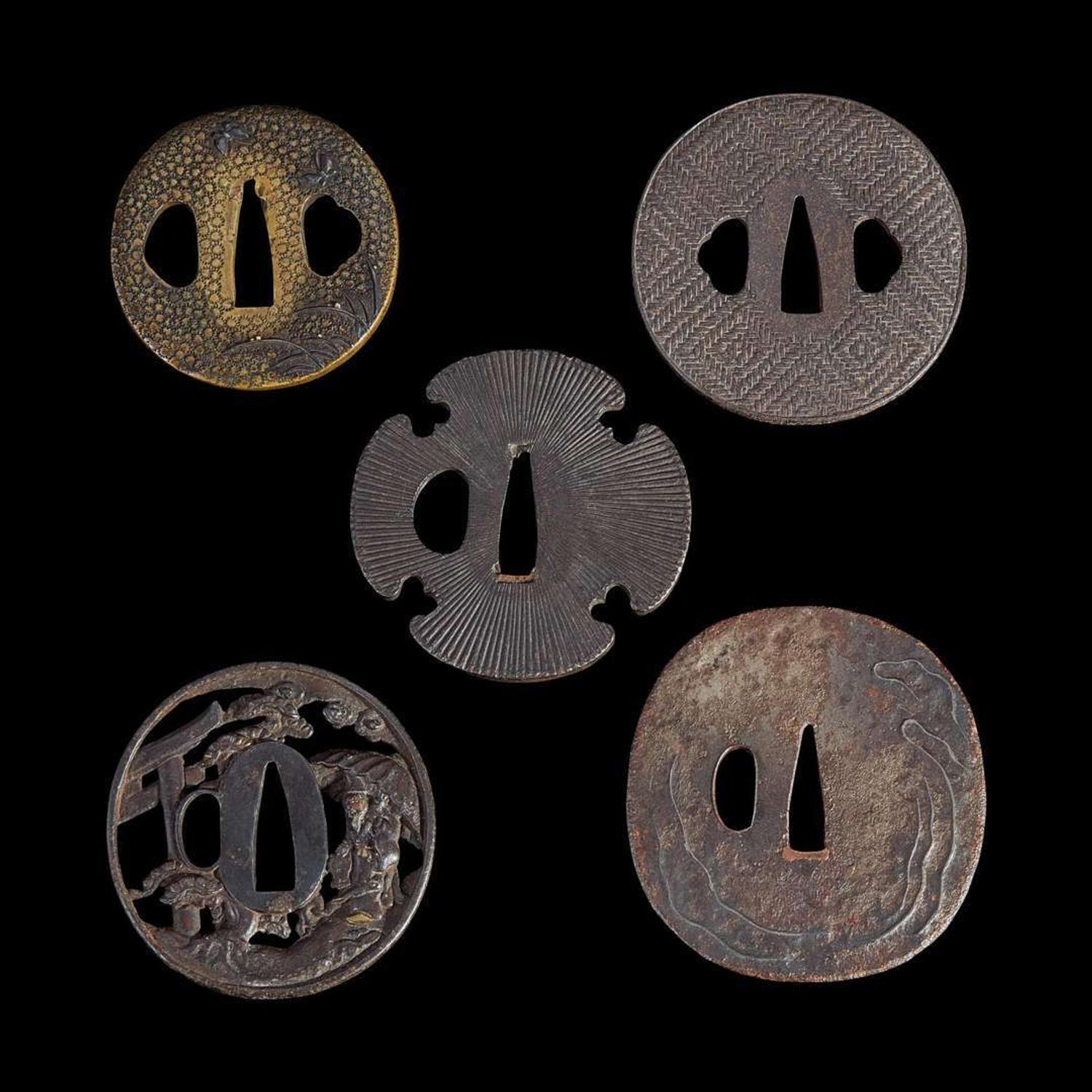 Group of nine Japanese tsuba Meiji period and earlier