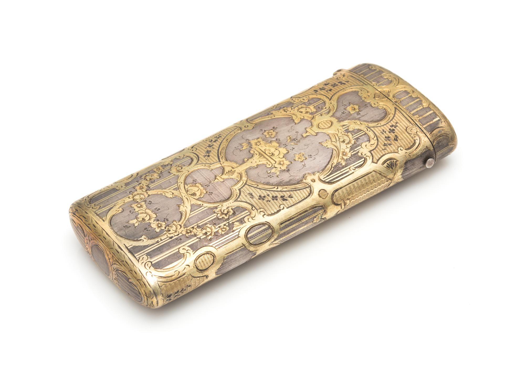 A French Silver-Gilt Spectacles Case, Maker's Mark Obscured, Late 19th/Early 20th Century, the case worked to show floral sprays on an