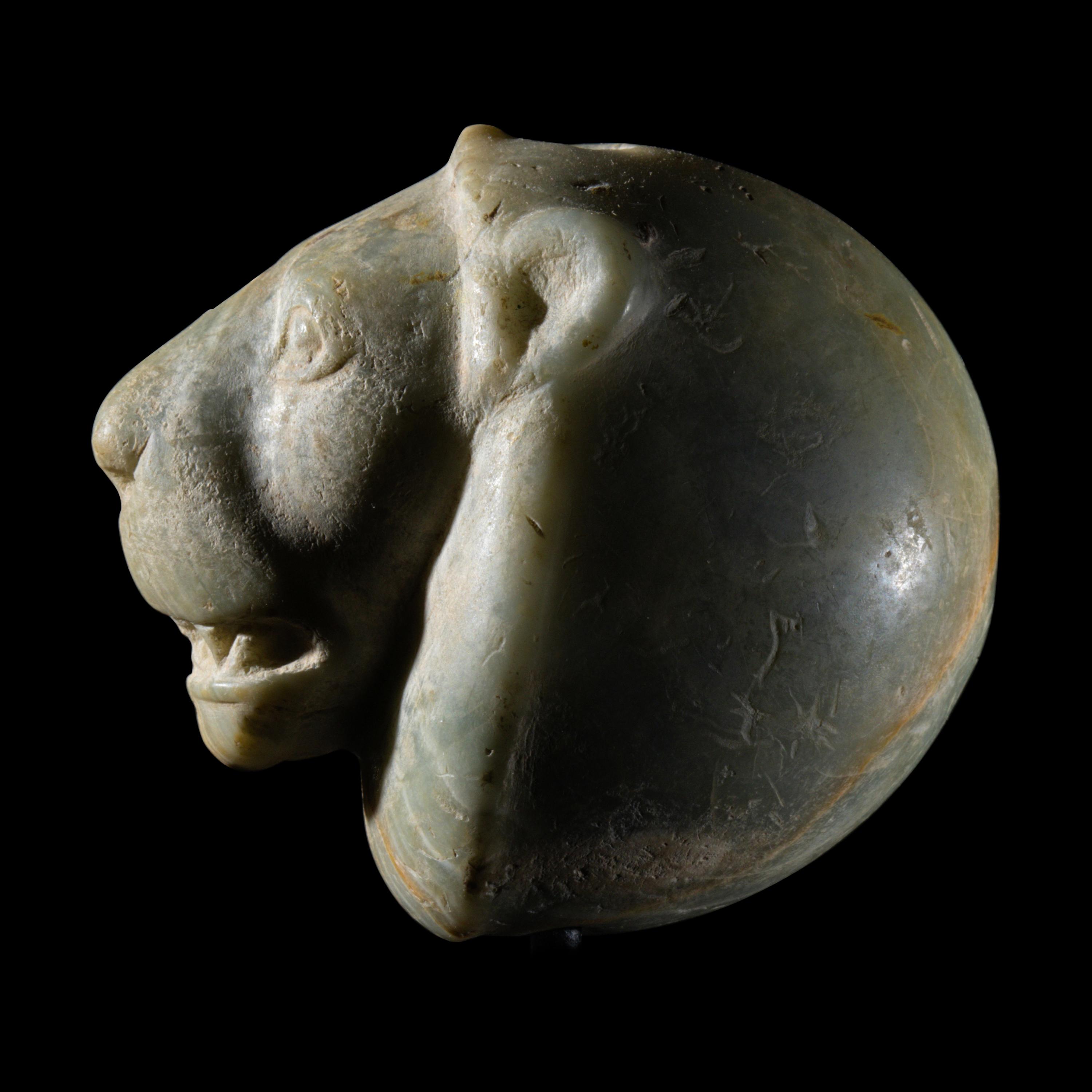 A Mesopotamian Green Stone Seal with a Lion Head