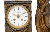An Empire Style Gilt Metal and Marble Figural Mantel Clock