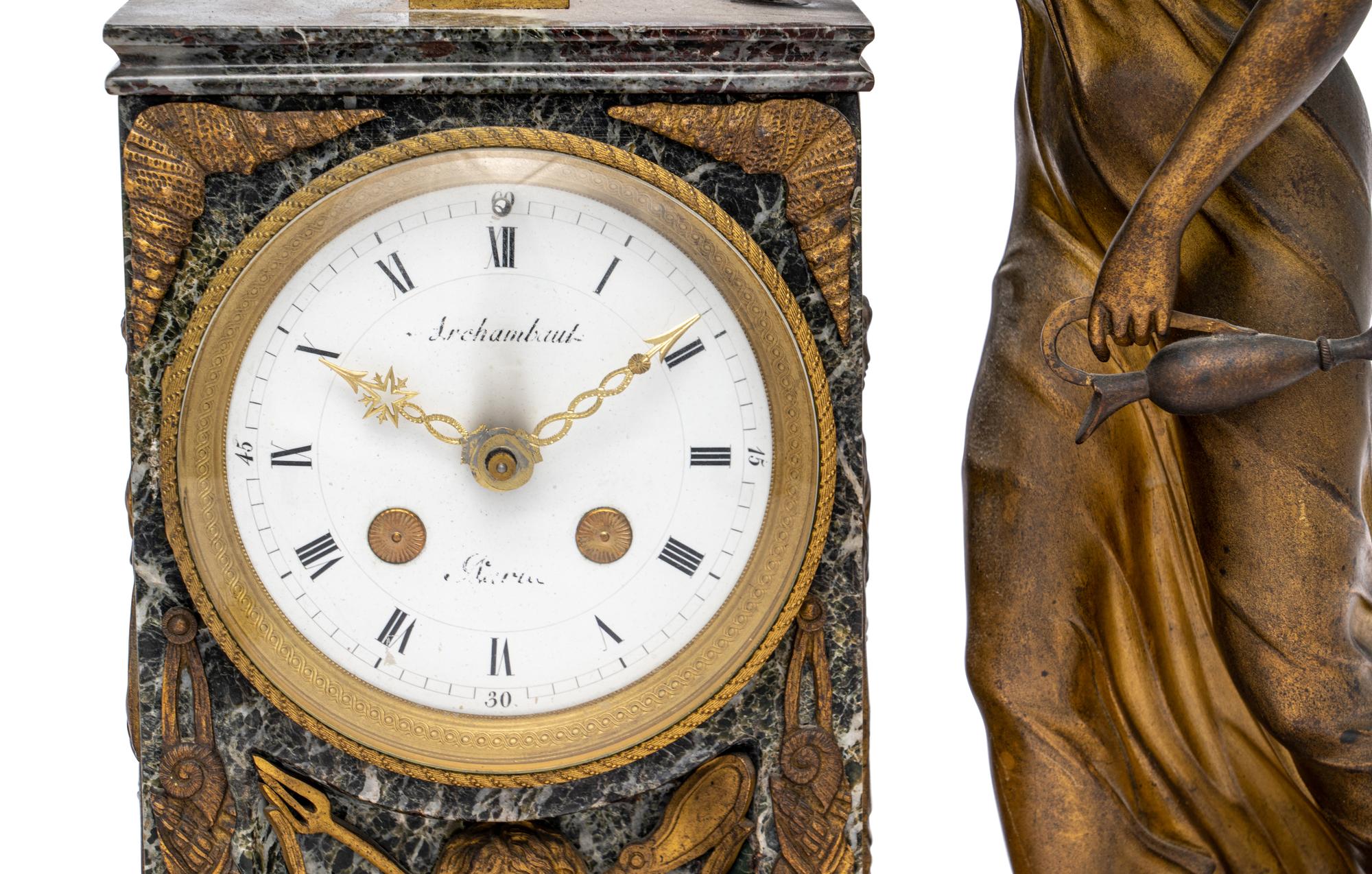 An Empire Style Gilt Metal and Marble Figural Mantel Clock