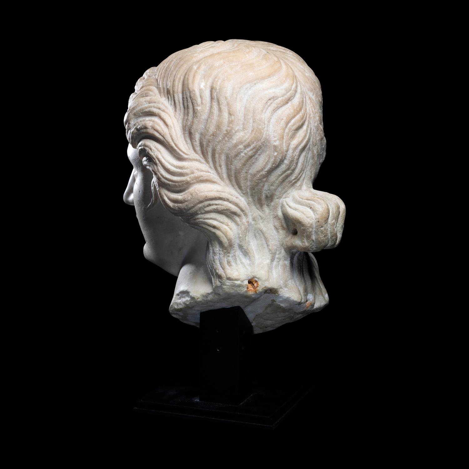 A Roman Marble Head of a Goddess or Youthful God