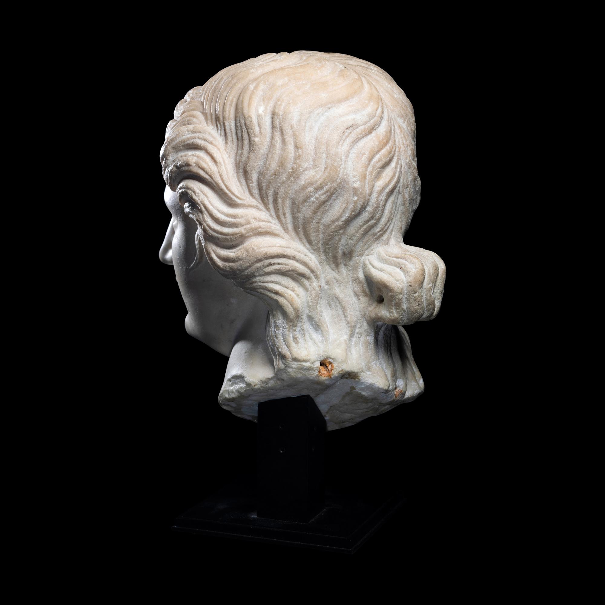 A Roman Marble Head of a Goddess or Youthful God