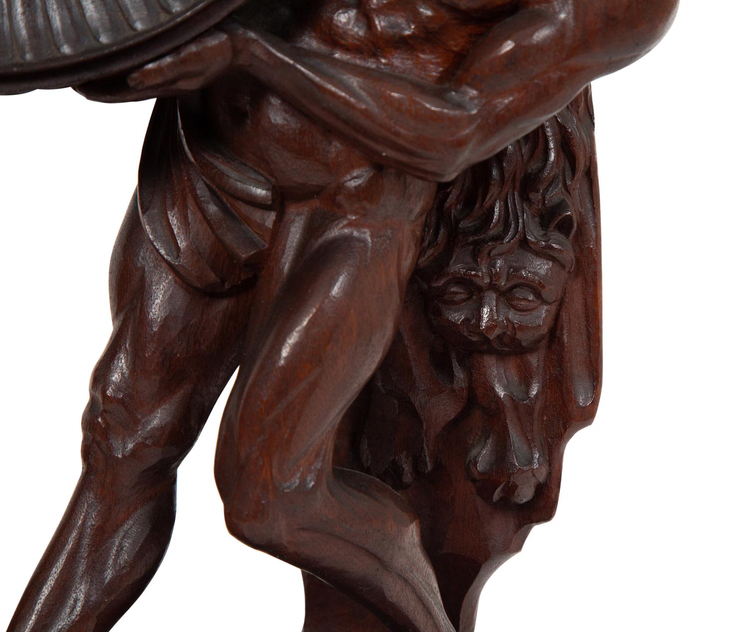 A Continental Carved Oak Figural Clock