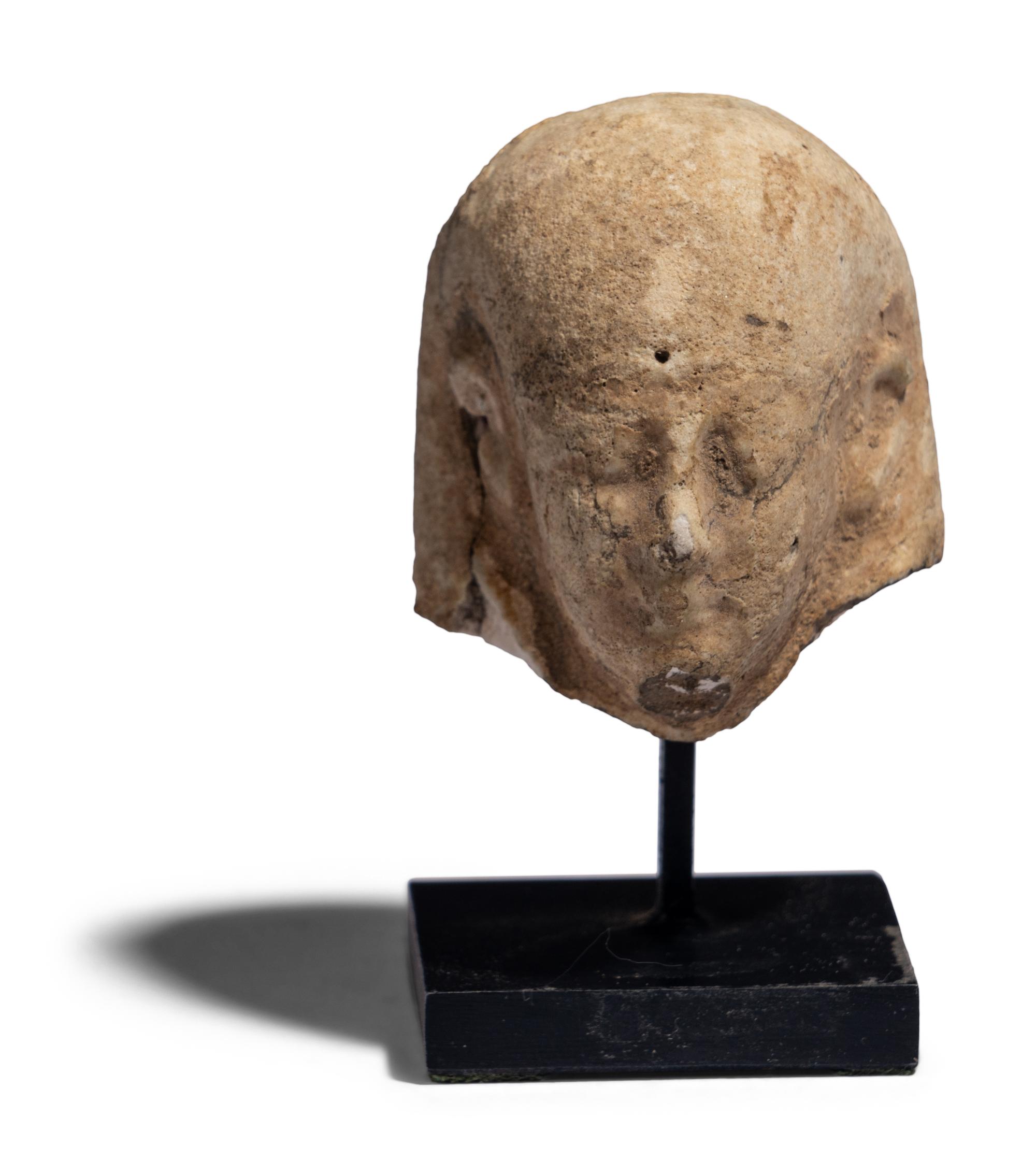 An Egyptian Faience Ushabti Head