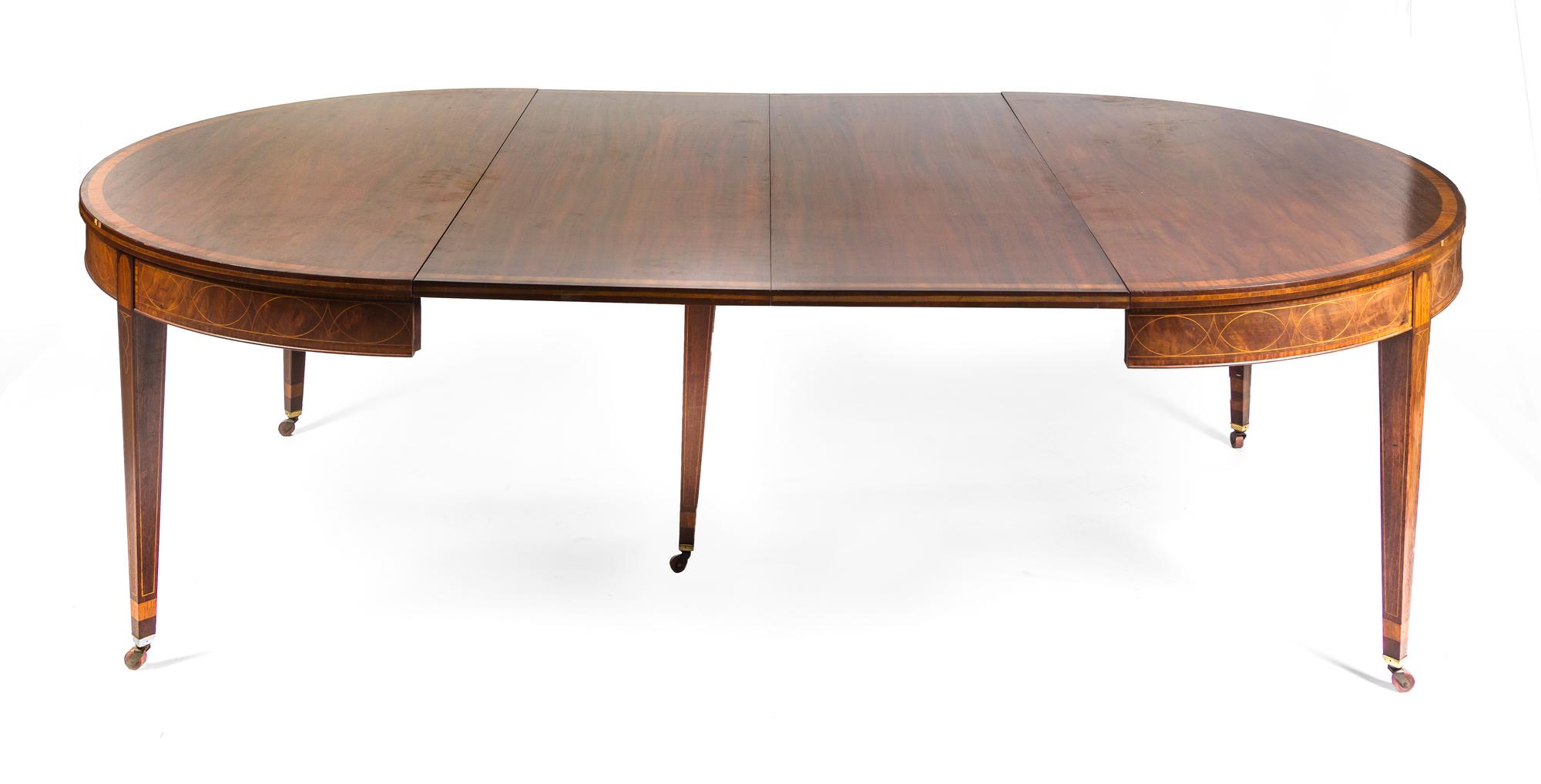 A Mahogany Extension Dining Table Height 29 1/2 x width 104 x depth 60 inches.