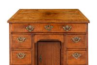 A George II Walnut Kneehole Desk