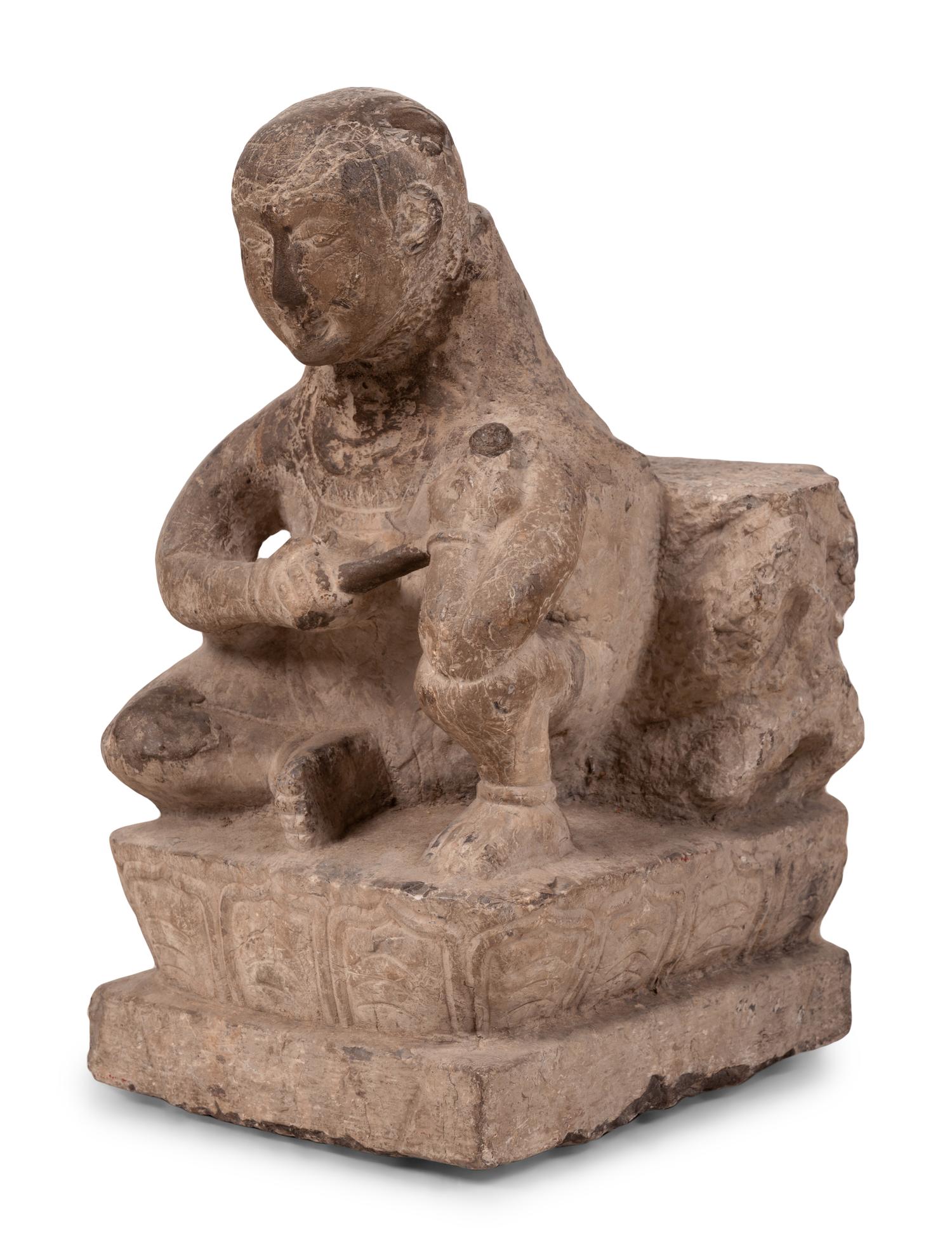 An Asian Carved Stone Seated Figure