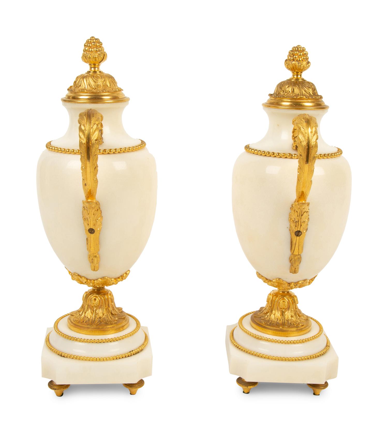 A Pair of Empire Style Gilt Bronze Mounted White Marble Urns — 19TH/20TH CENTURY