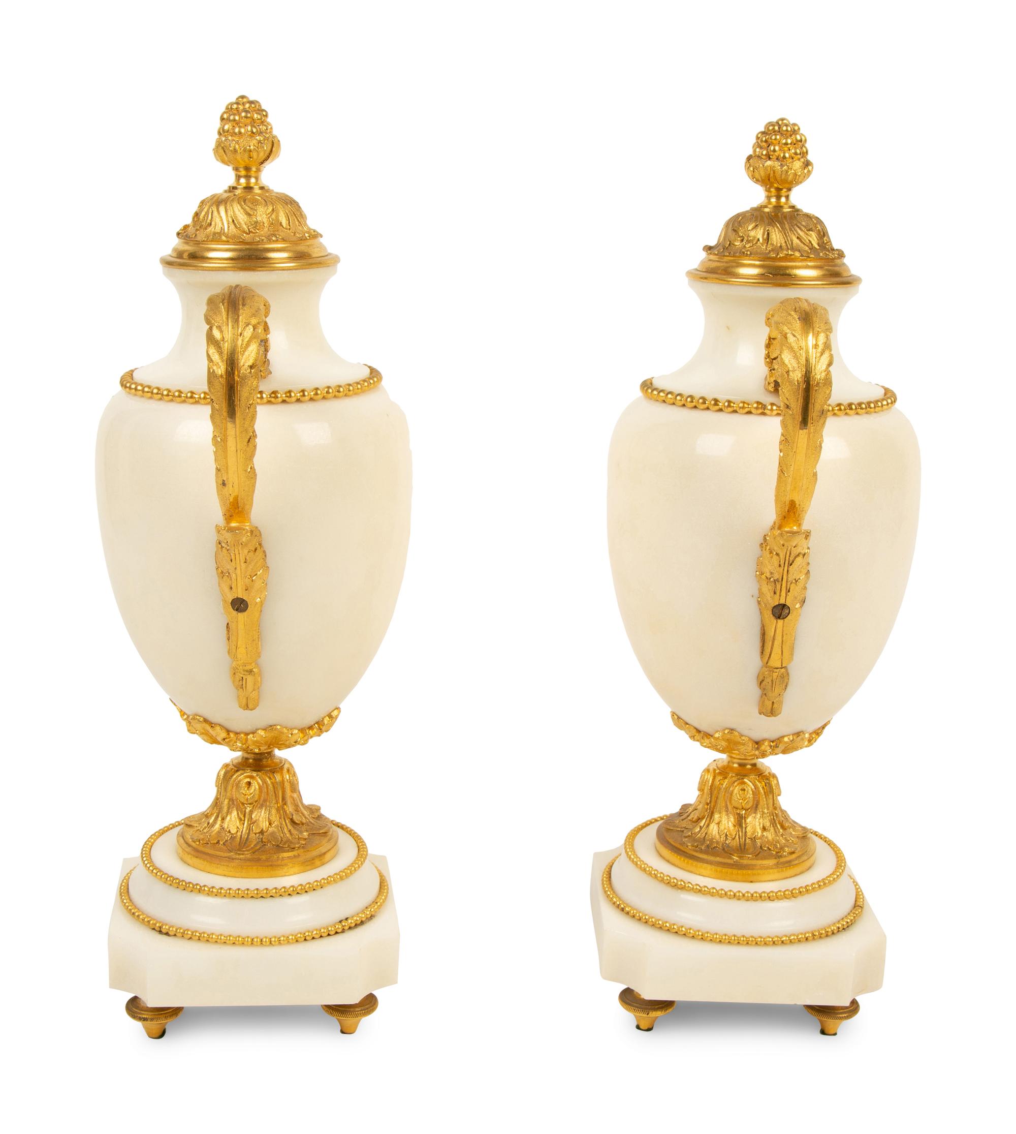 A Pair of Empire Style Gilt Bronze Mounted White Marble Urns — 19TH/20TH CENTURY