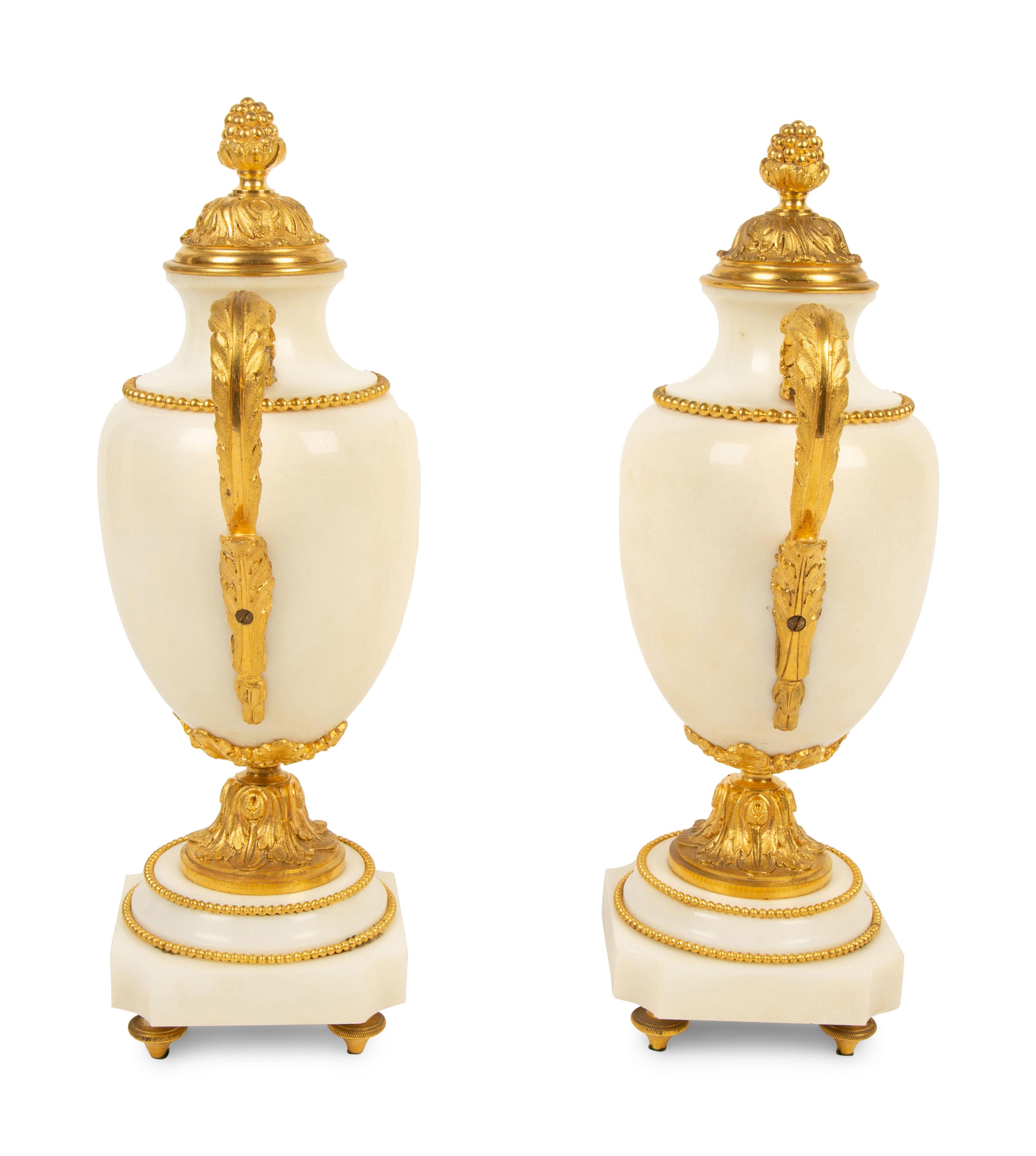 A Pair of Empire Style Gilt Bronze Mounted White Marble Urns — 19TH/20TH CENTURY