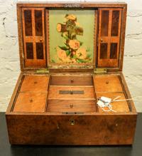 A Wooden Sewing Box. Height 5 1/4 x width 8 x depth 12 inches.