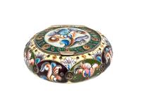 A Russian Enameled Silver Box, 6th Artel, Moscow, 1908-1926, of circular form with polychrome floral decoration.