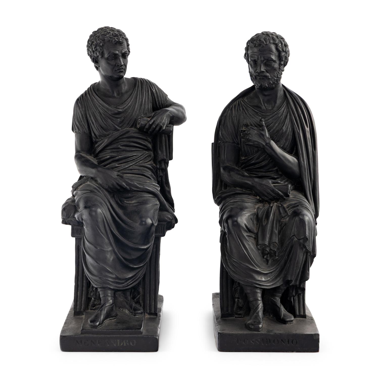 A Pair of Black Earthenware or Composition Figures