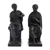 A Pair of Black Earthenware or Composition Figures