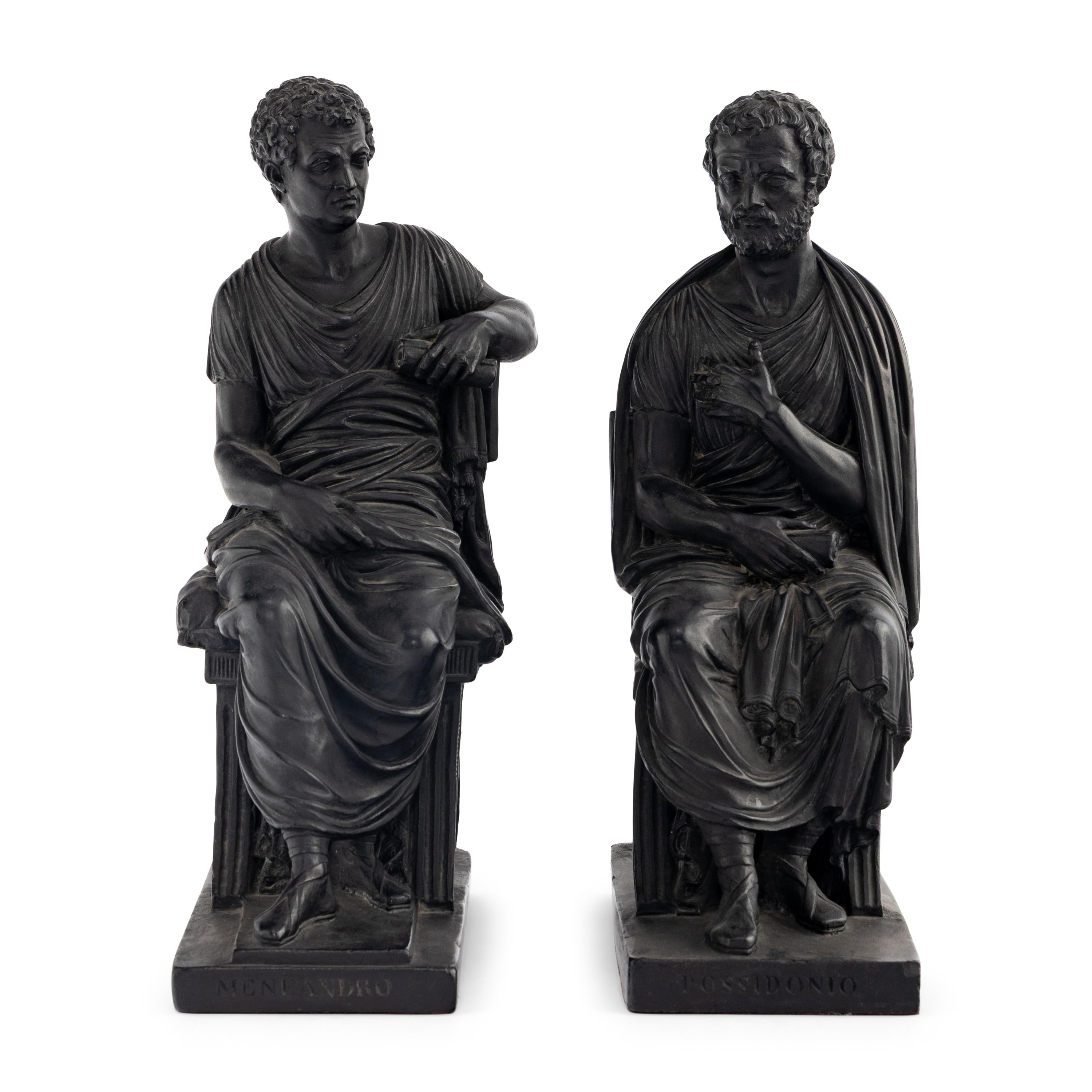A Pair of Black Earthenware or Composition Figures