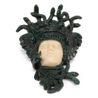A Carved Green and Yellow Aventurine Medusa Wall Ornament