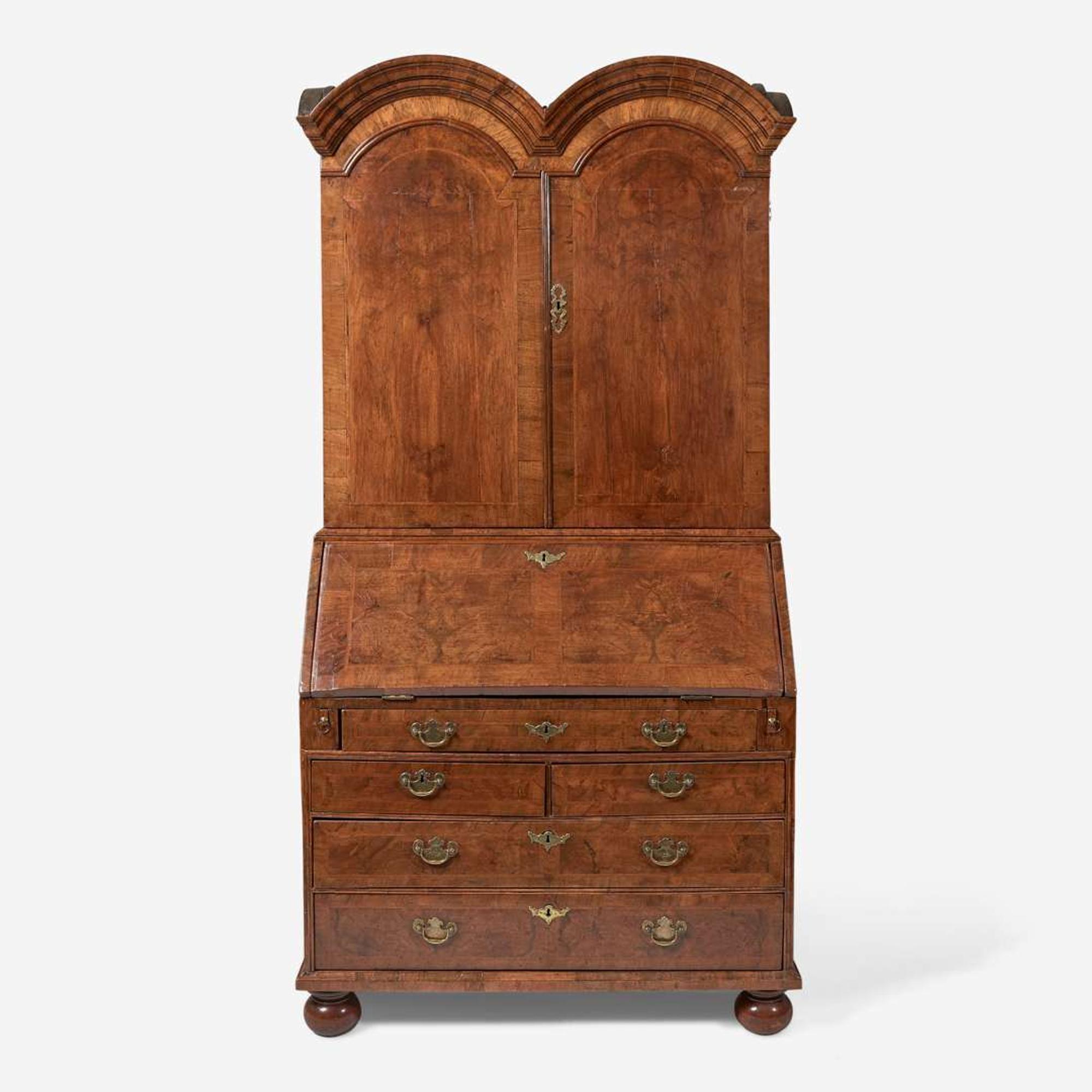 A William & Mary walnut double dome secretary bureau circa 1710