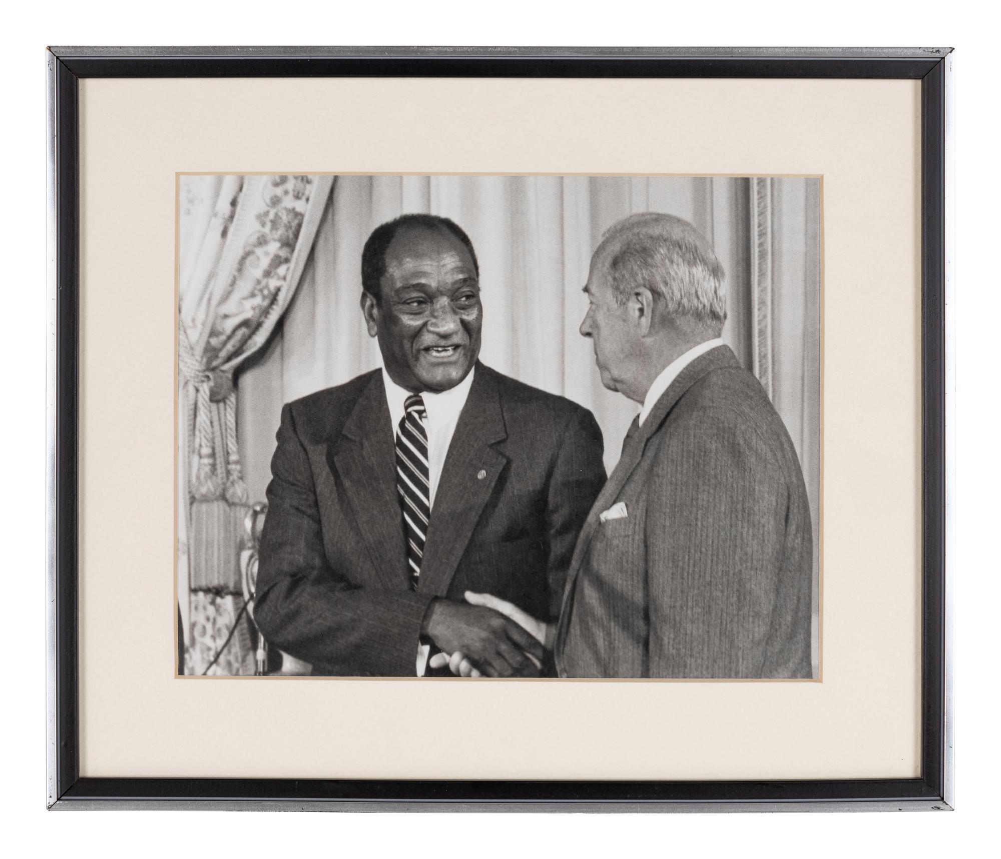 [PERKINS, Edward Joseph (1928-2020)]. A group of 10 photographs in 9 frames, from political figures to Perkins, many signed or inscribed (several presumably with secretarial or facsimile signatures), including: