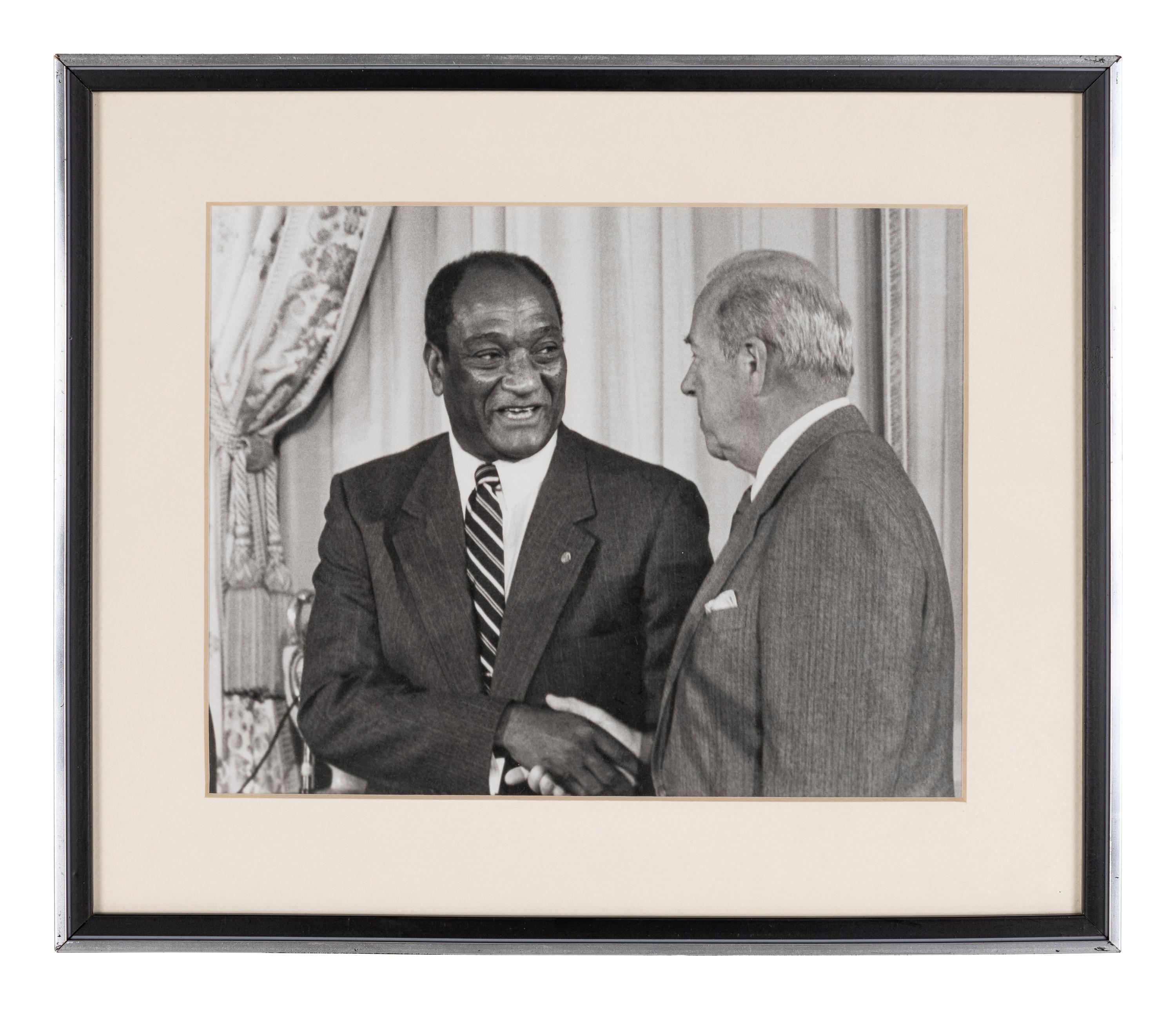 [PERKINS, Edward Joseph (1928-2020)]. A group of 10 photographs in 9 frames, from political figures to Perkins, many signed or inscribed (several presumably with secretarial or facsimile signatures), including: