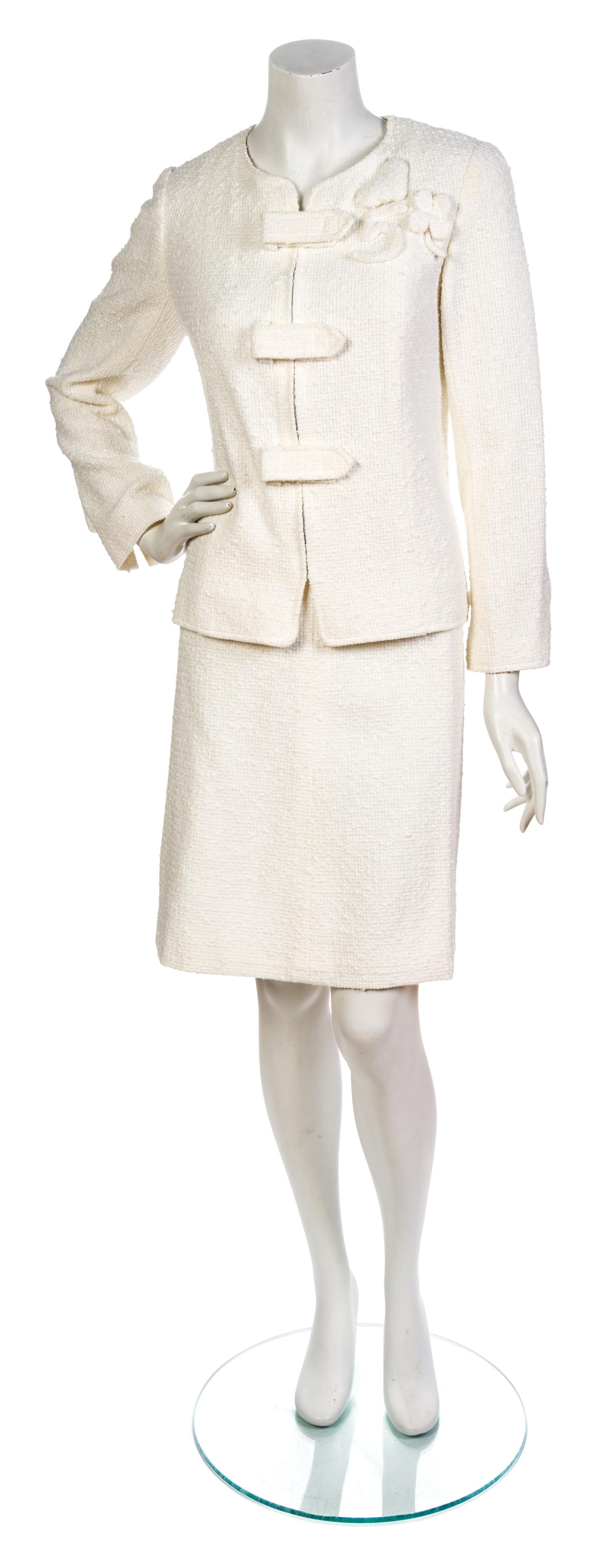 A Chanel White Cotton Boucle Skirt Suit, Jacket size 44, skirt size 42.