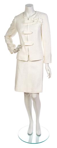 A Chanel White Cotton Boucle Skirt Suit, Jacket size 44, skirt size 42.
