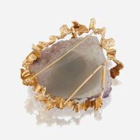 An amethyst geode and fourteen karat gold pendant/brooch