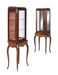 A Near Pair of Louis XV/XVI Transitional Style Gilt Metal Mounted Vitrines