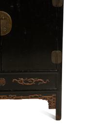A Chinese Black Lacquer Cabinet with Pierce-carved Upper Door Panels