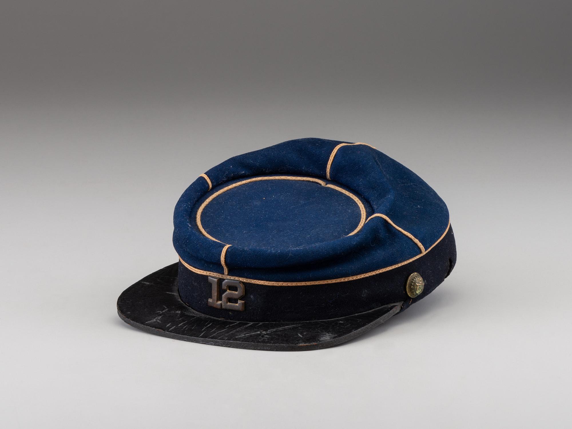 [CIVIL WAR]. Late-war 12th New York Militia kepi, manufactured by J.H. McKenney & Co., New York.