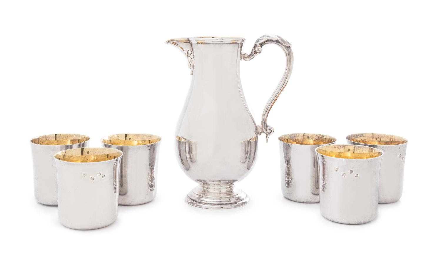 An Irish Silver Beer Jug and Six Beakers, Royal Irish Silver Co., Dublin, 1969, the beer jug in the Georgian taste and of baluster form