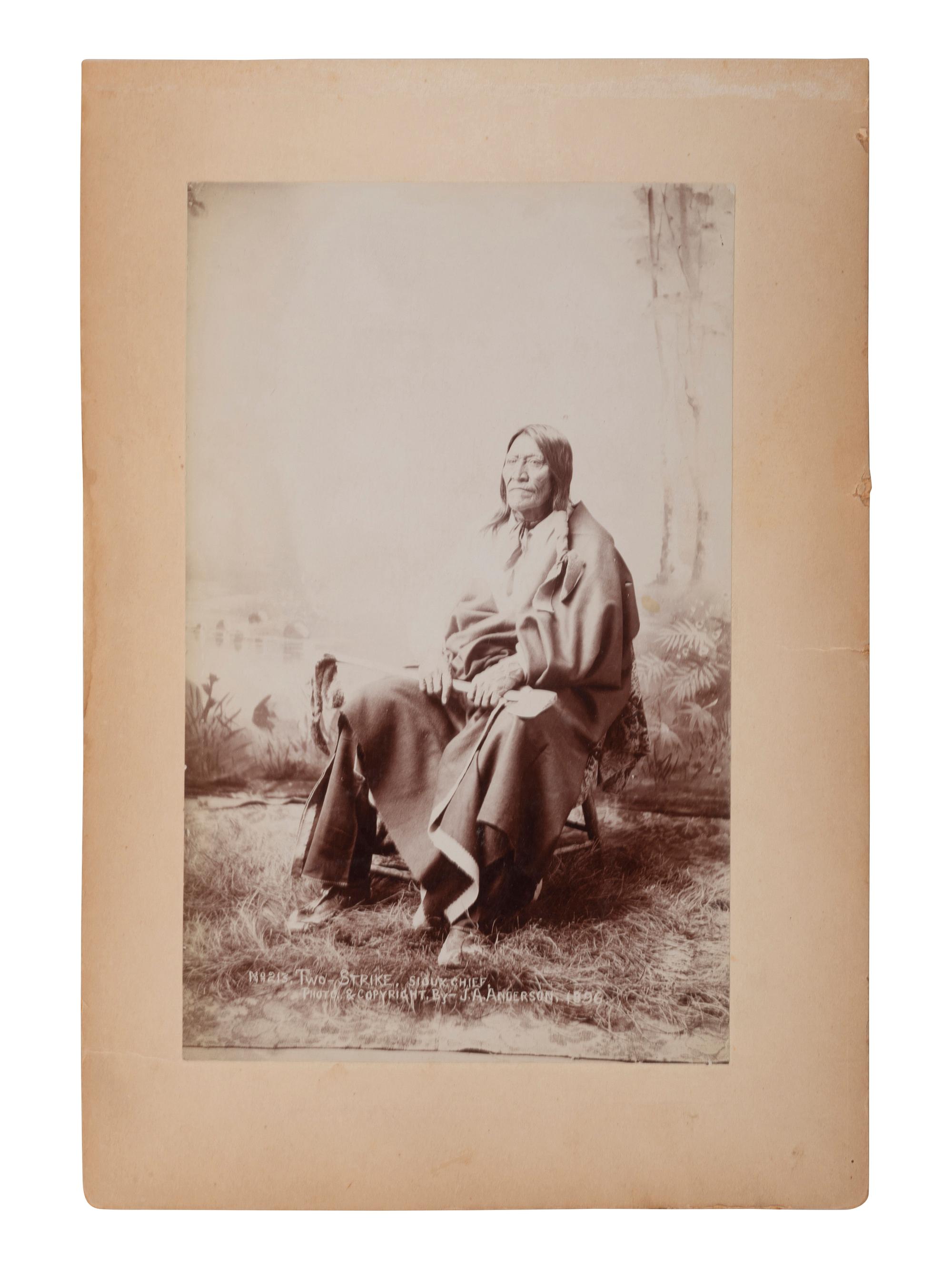 [NATIVE AMERICANS]. [ANDERSON, John A., photographer (1869-1948)]. Two photographs of Sioux Indians, incl. Two Strikes.
