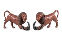 A Pair of Carved and Painted Wood Lions Wrestling Serpents