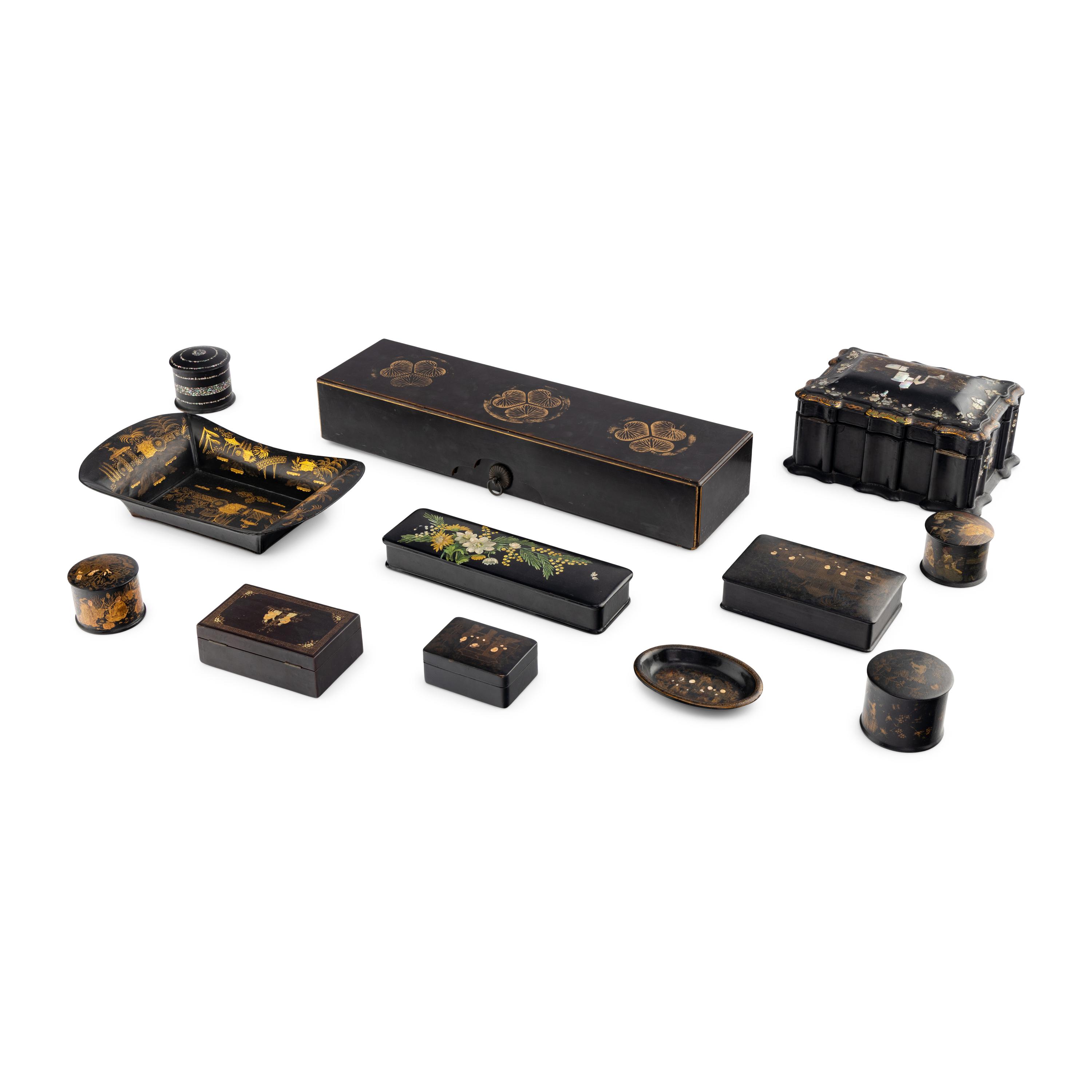 A Group of Twelve Black Laquer Table Articles