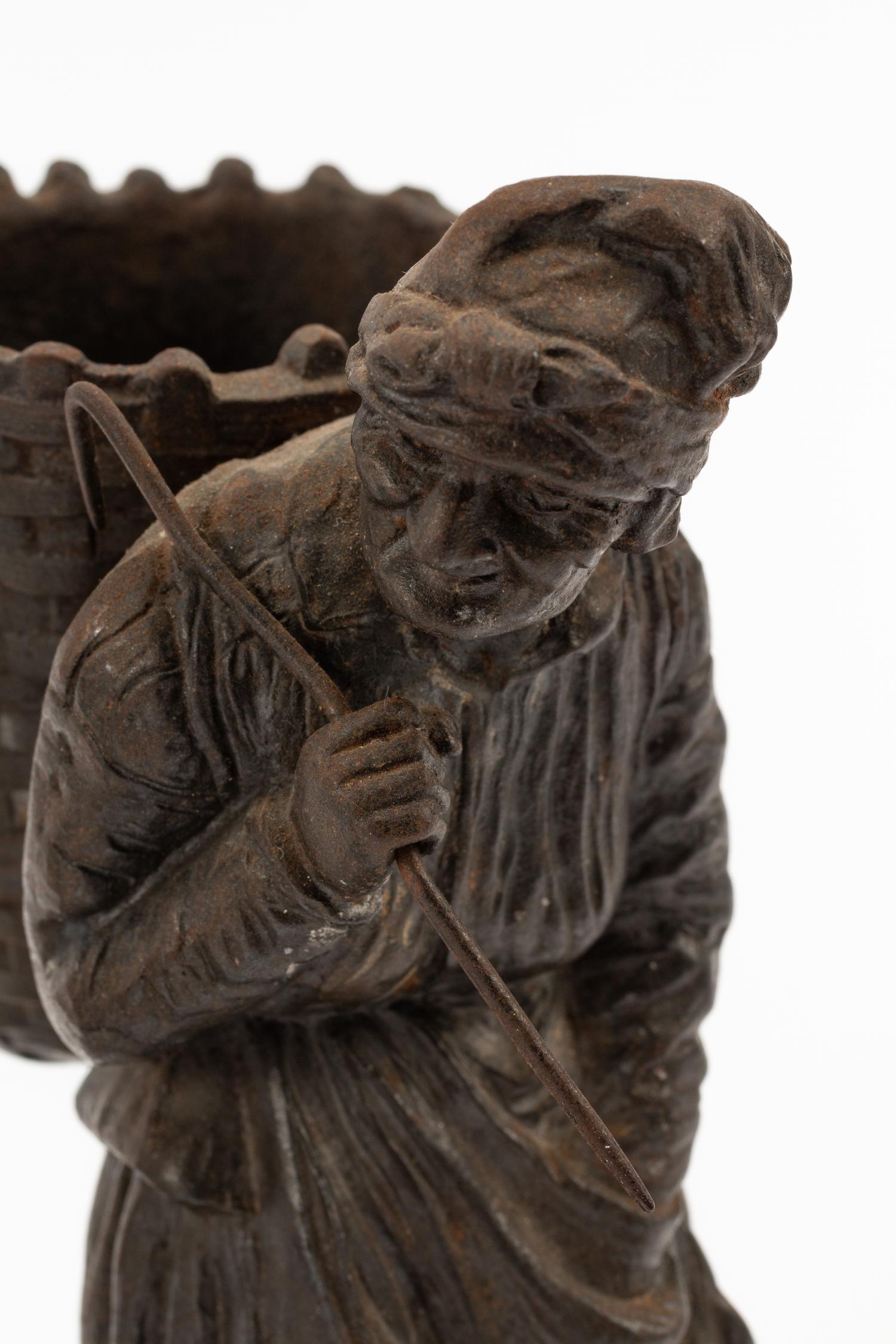 A Pair of Continental Bronze Figures of Peasant Farmers