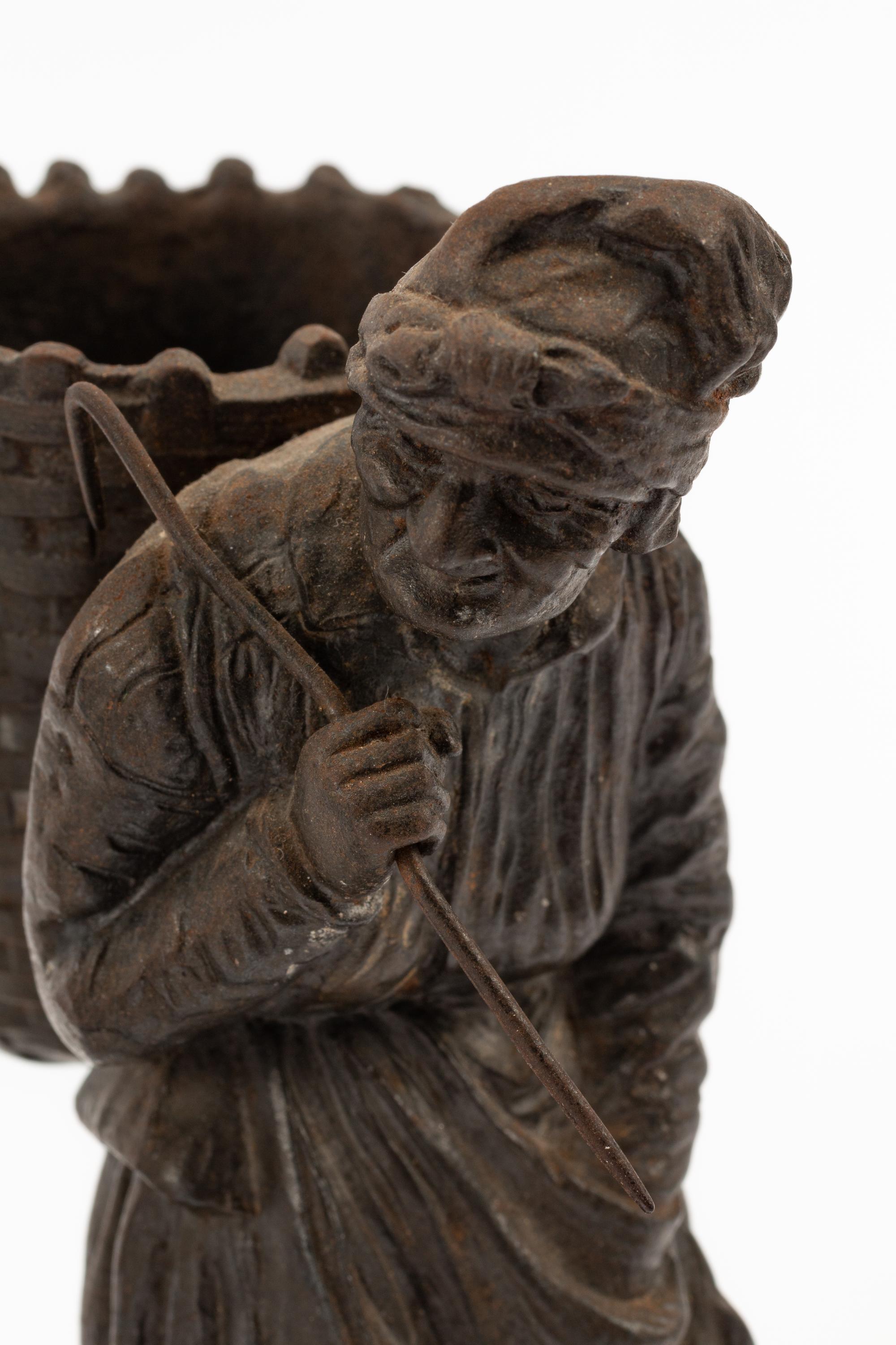 A Pair of Continental Bronze Figures of Peasant Farmers