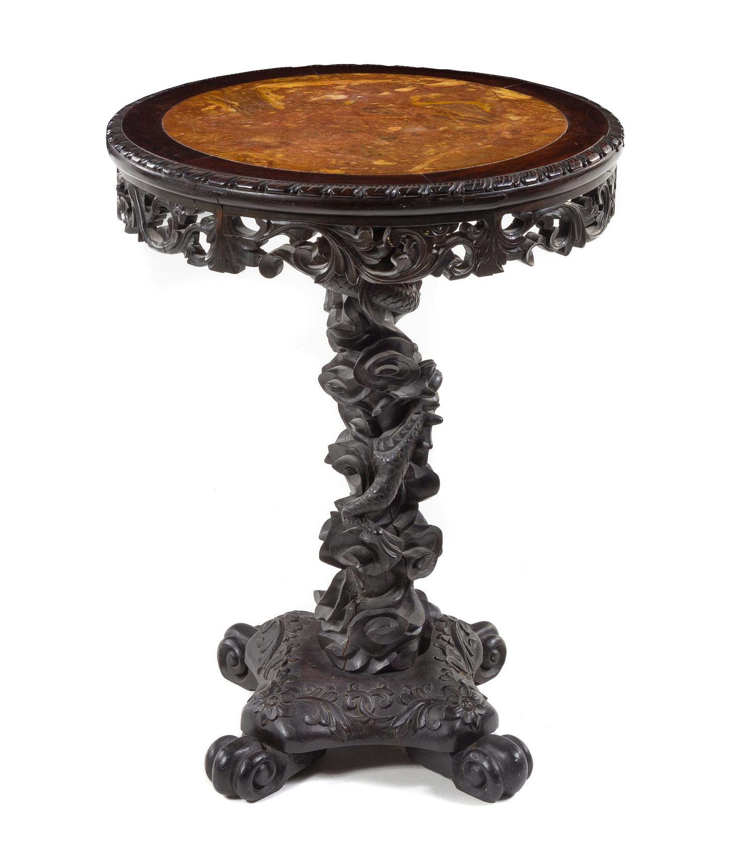 A Chinese Carved Teak Table Height 29 x diameter of top 21 1/2 inches. — LATE 19TH CENTURY