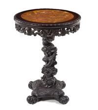 A Chinese Carved Teak Table Height 29 x diameter of top 21 1/2 inches. — LATE 19TH CENTURY