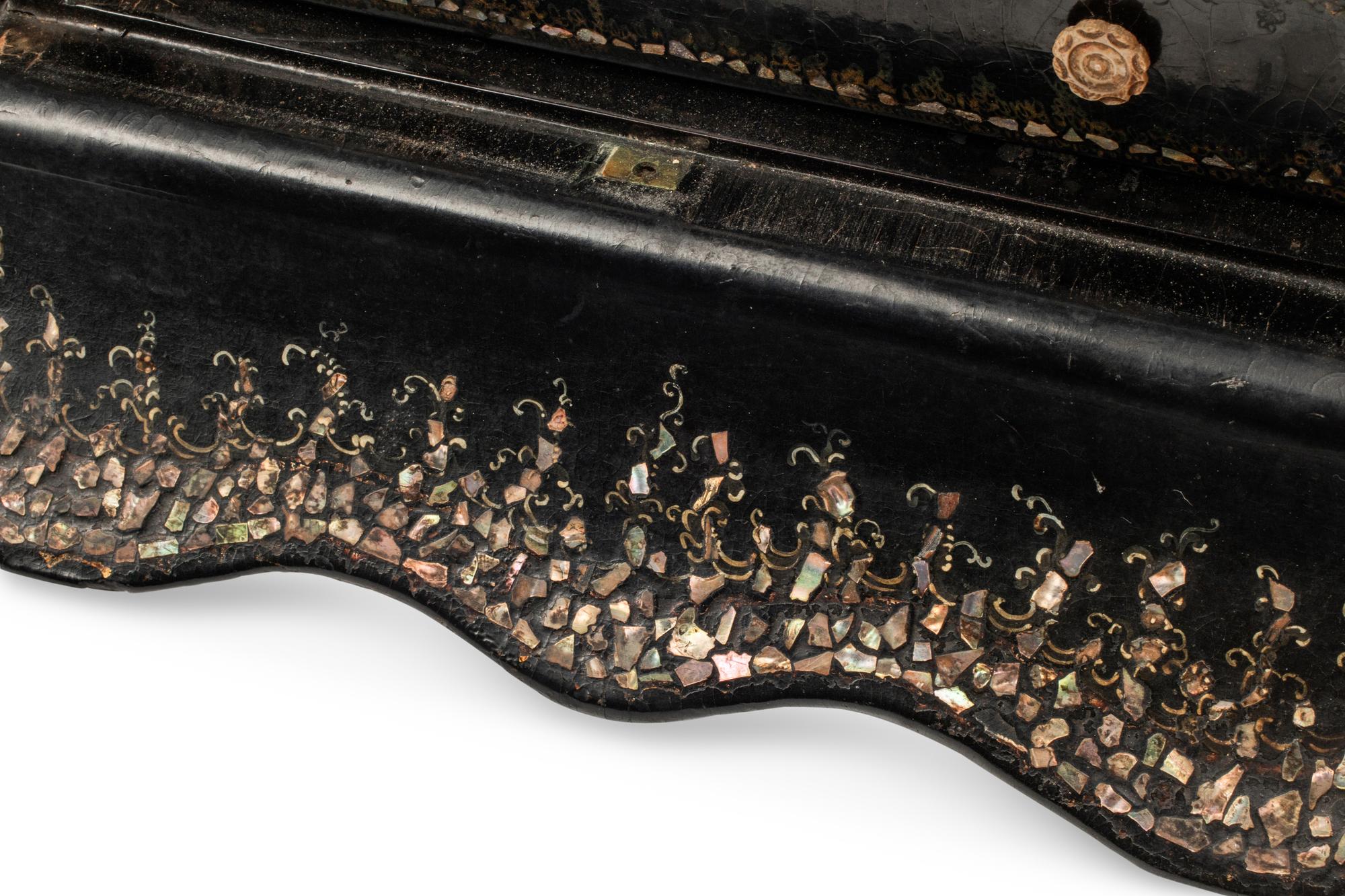 An English Mother-of-Pearl Inlaid Ebonized Cabinet