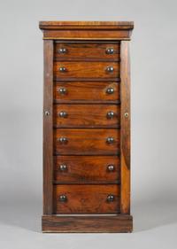 A Rosewood Wellington Chest, Height 47 x width 21 x depth 14 1/4 inches.