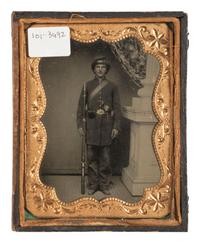 [CIVIL WAR]. Tintype portrait of a doubly armed soldier in full kit.