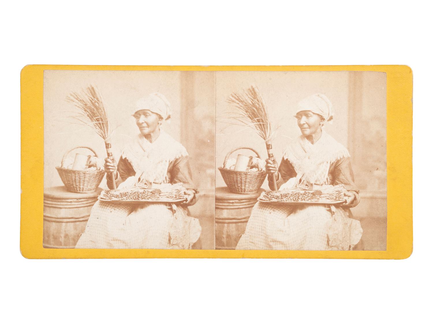[EARLY PHOTOGRAPHY]. Stereoview of an African American house servant holding a tray.