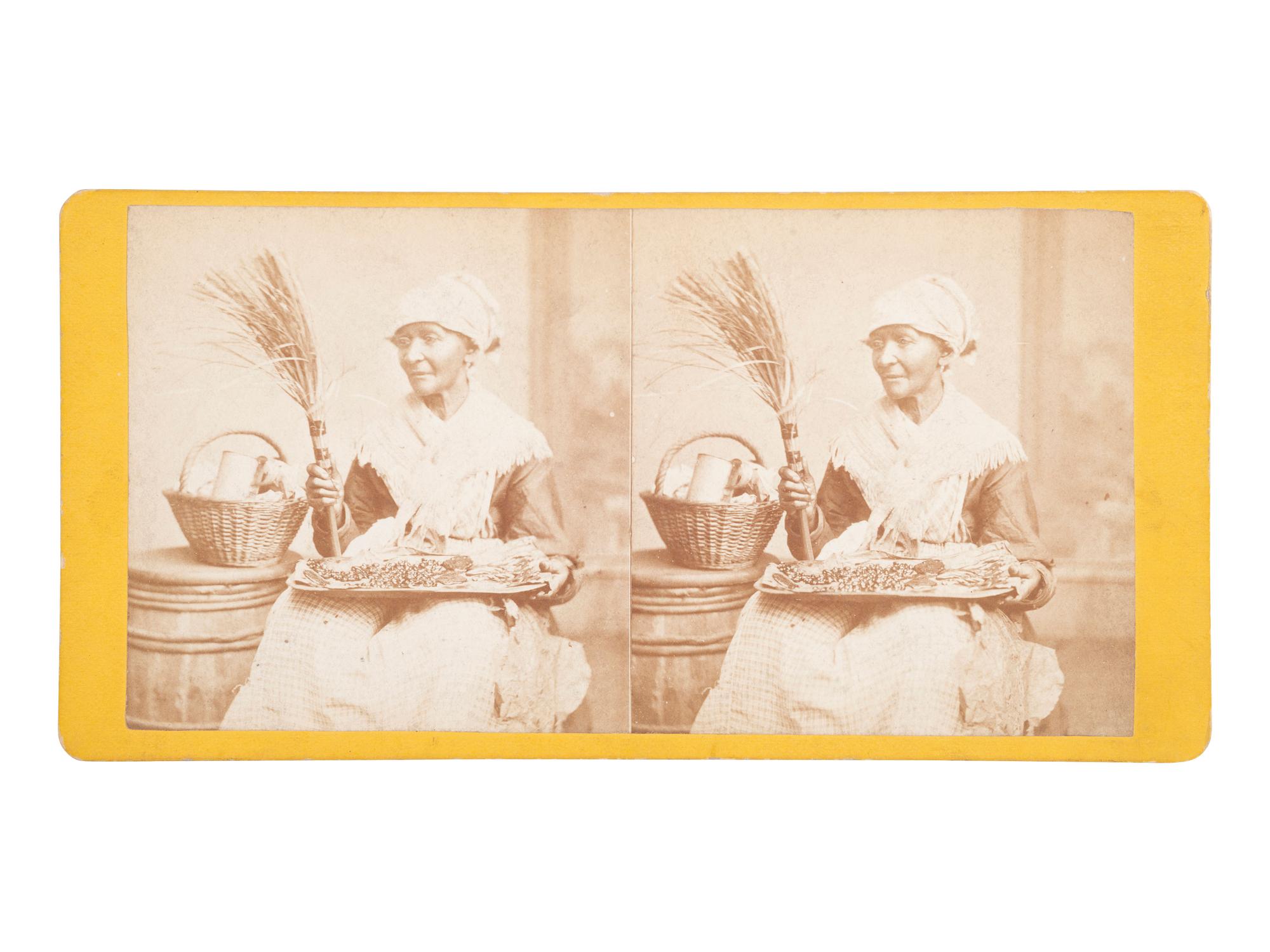 [EARLY PHOTOGRAPHY]. Stereoview of an African American house servant holding a tray.