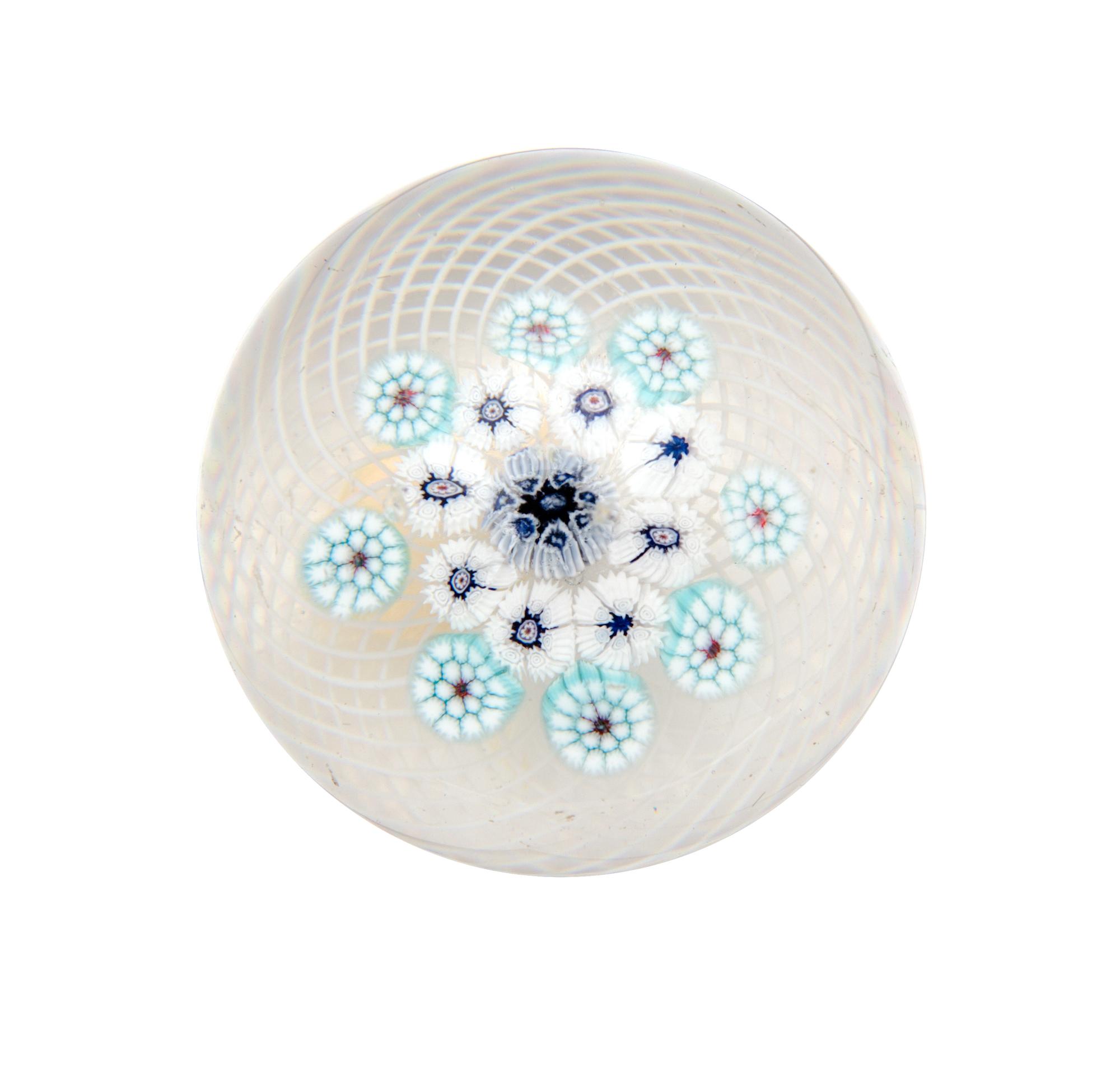 Clichy, France, 19TH CENTURY, blue and white edelweis miniature paperweight, on latticino ground
