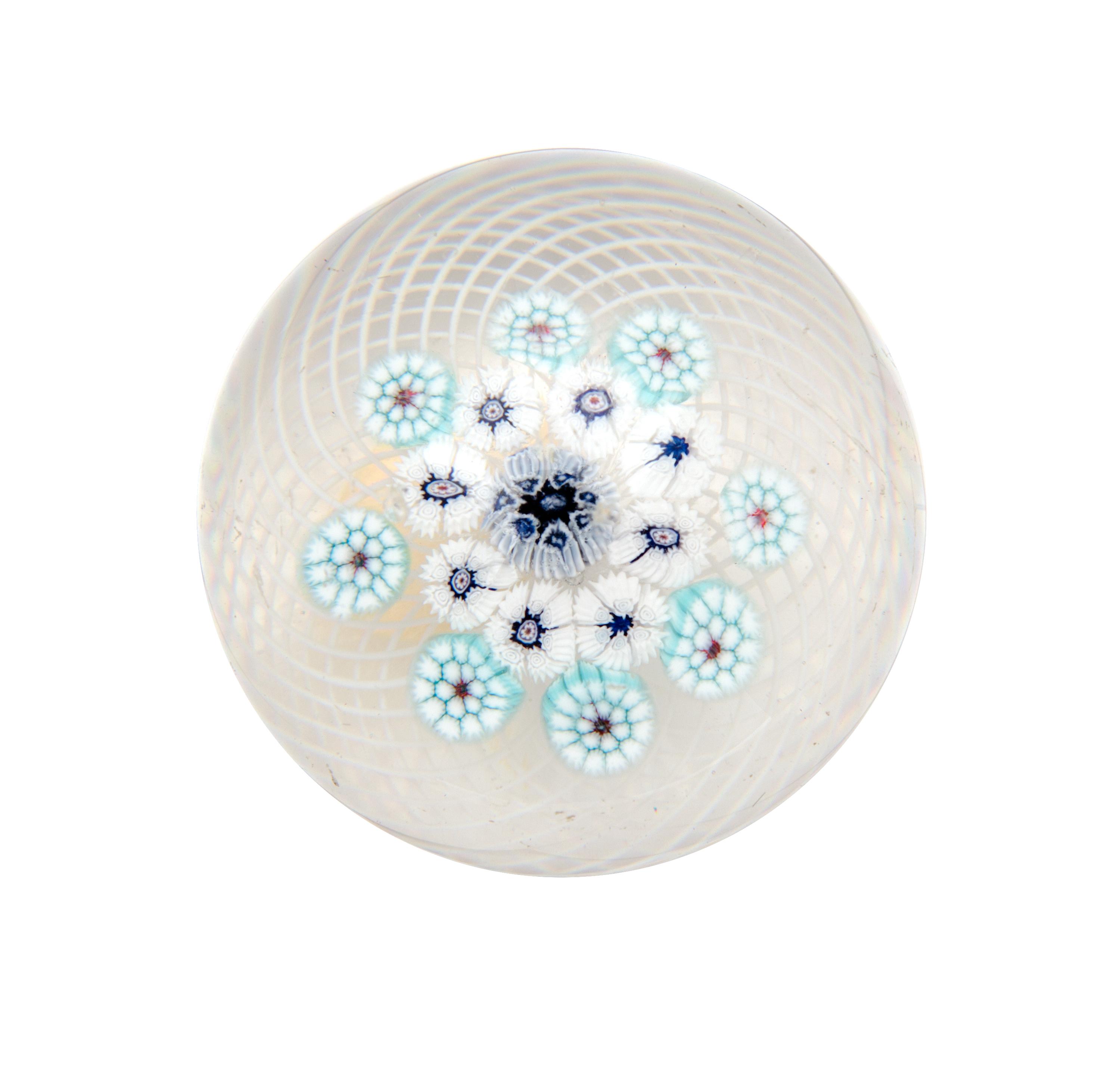 Clichy, France, 19TH CENTURY, blue and white edelweis miniature paperweight, on latticino ground
