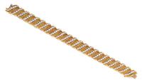 A Yellow Gold, Platinum and Diamond Bracelet, 48.55 dwts.