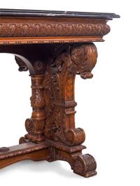 A Karpen Renaissance Revival Carved Oak Marble-Top Table